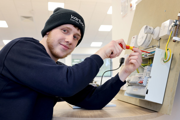 Man fixing a circuit board.