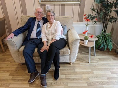 A couple sitting next to each other
