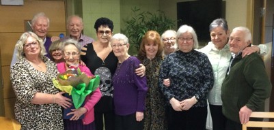 A group of people standing next to each other